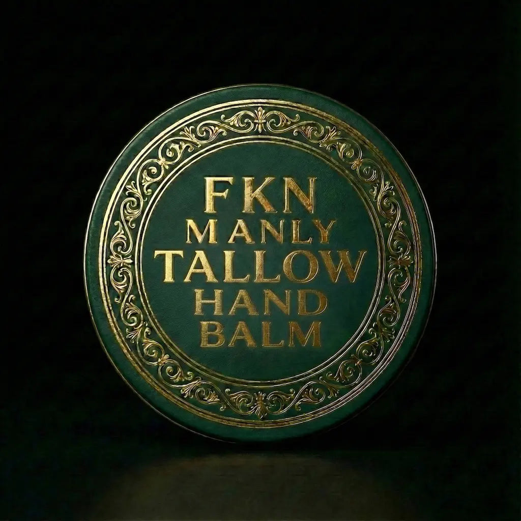 Round container of FKN Manly Grass Fed Tallow Hand Balm with decorative gold text on a dark background