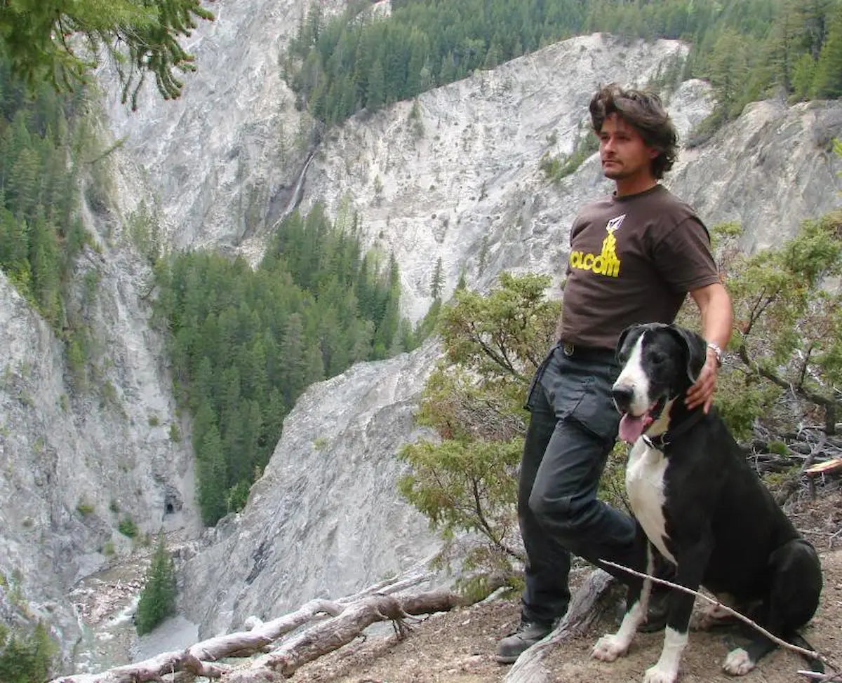 An image of the founder of Fkn Manly soap, Mike Sampson and his dog on the side of a mountain