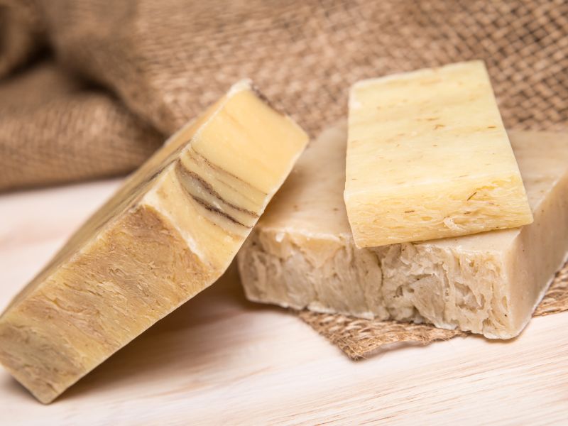 Natural soap bars, brown and beige, sitting on a counter